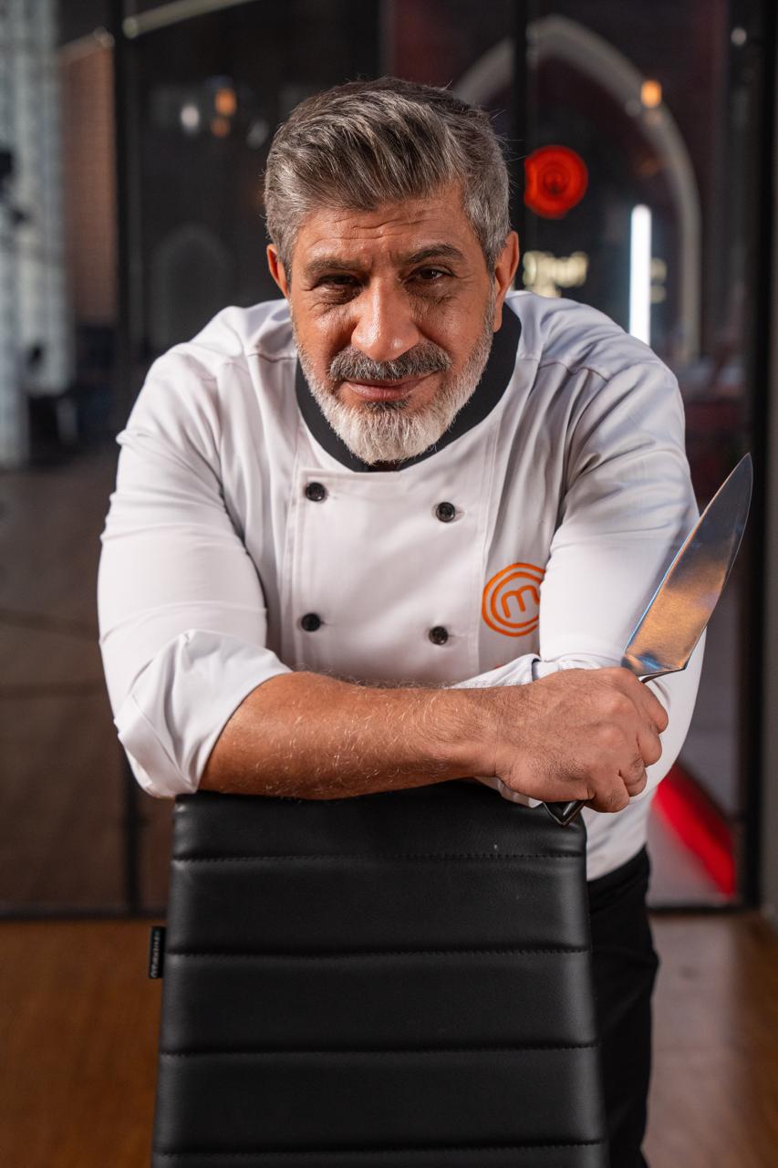 Chef Saadat plating a dish